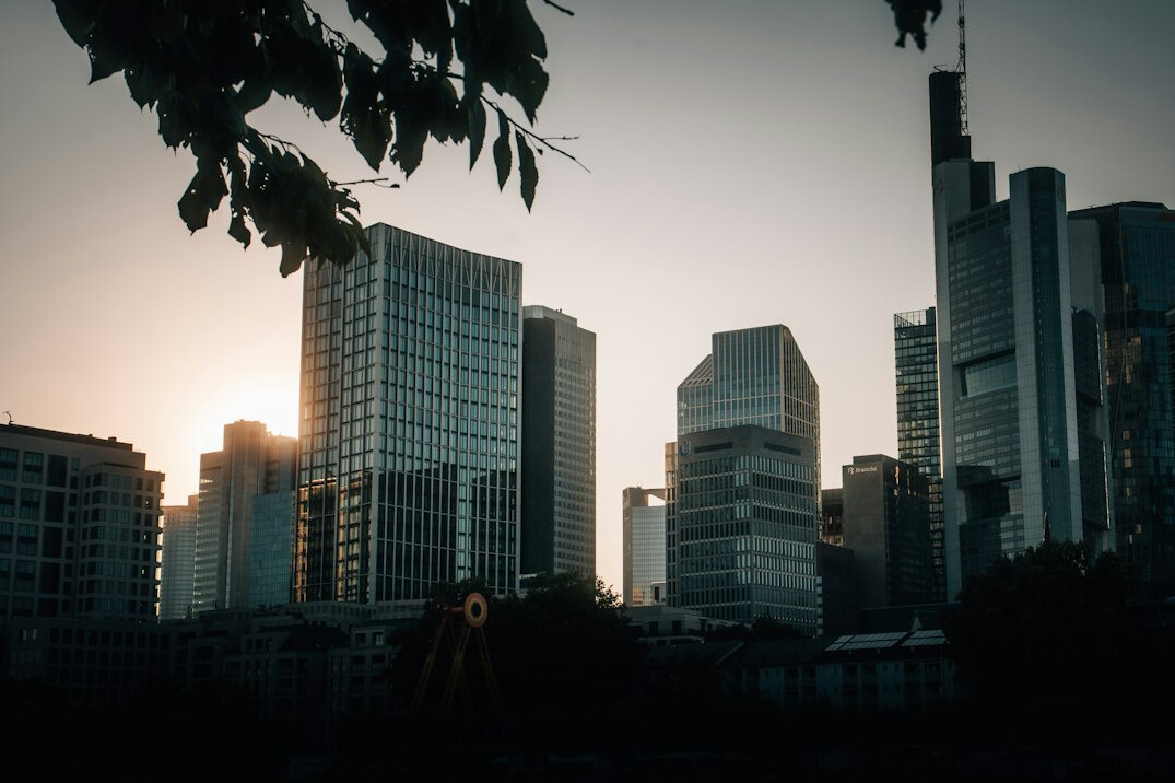 Aerial view of a European financial district skyline at dusk